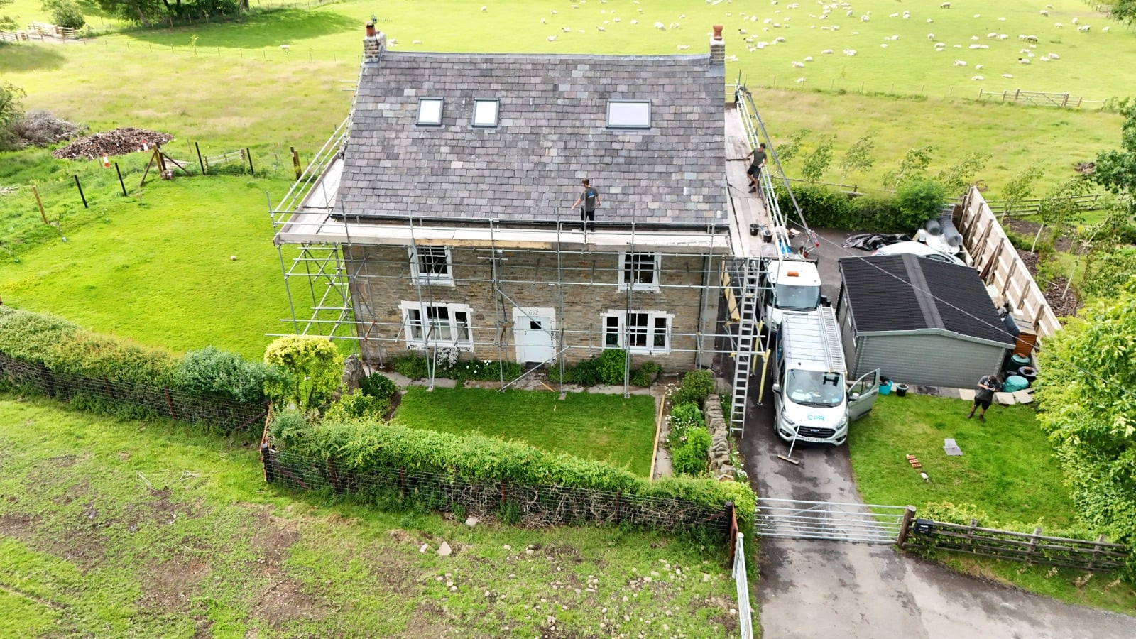 Aerial drone view of a North Point Roofing re-roofing project in progress