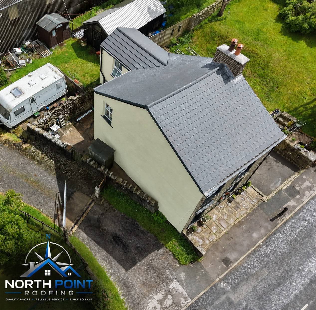 Roofer installing a new tiled roof on a property in Lancashire